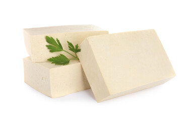 Blocks of delicious raw tofu with parsley on white background