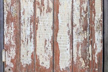 Old wood boards with peeling white paint texture background. Abstract board background. Weathered wooden wall with vertical white painted planks.