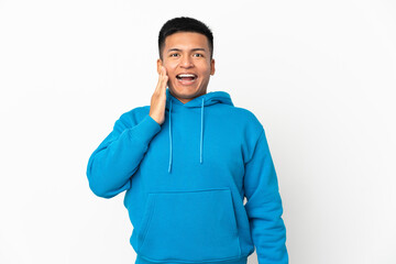 Young Ecuadorian man isolated on white background with surprise and shocked facial expression
