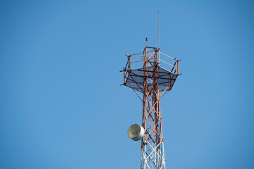 Communications tower with blue Cloud sky background