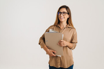 Smiling mid aged brunette woman with folder