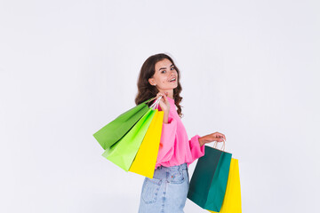 Fototapeta na wymiar Young beautiful woman with freckles light makeup in sweater on white background with shopping bags happy cheerful smiling