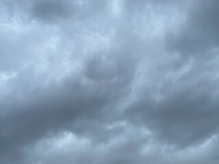 On the sky is covered all over by the clouds. Rain clouds background. Background of storm clouds before a thunder-storm