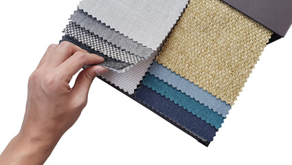interior designer's hand selecting cloth on fabric palette samples catalog isolated on white background with clipping path. drapery or upholstery selection by architects.