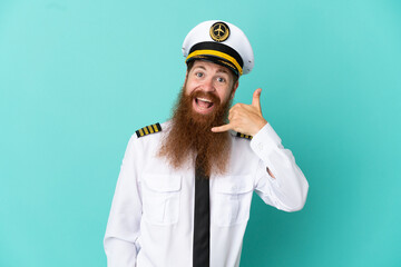 Redhead caucasian man playing rugby isolated on yellow background making phone gesture. Call me back sign