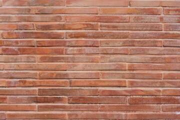 Photo of the front of the brick wall of the temple