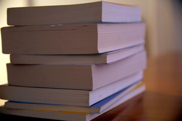 Close-up of a pile of books, view from the pages side