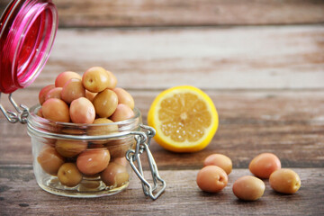 green pickled olives in a glass jar
