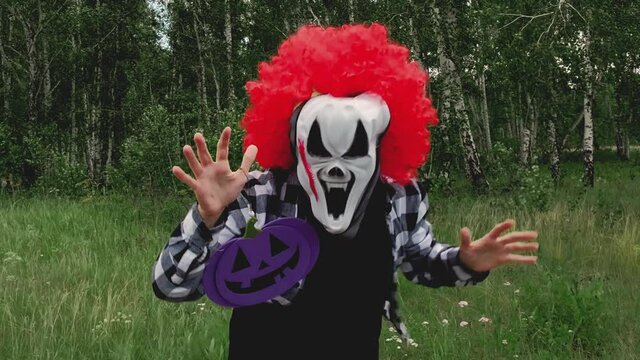 Scary clown dances and scares at a Halloween party.