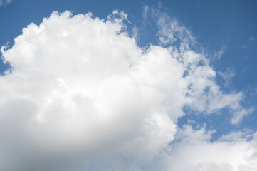 Blue sky with large white clouds.