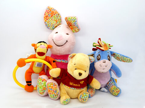Winnie the Pooh, Piglet, Eeyore - Igor, and Tigger. Teddy bear belonging to Christopher Robin. Honey loving yellow bear. Walt Disney character from books, movies and television series. Toys for babies