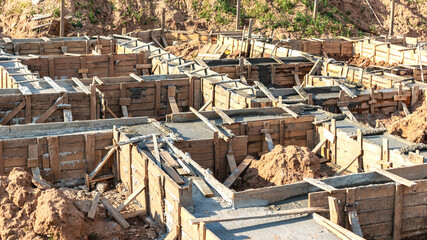 Strip foundations with formwork during the construction of a house. Reliable reinforced concrete...