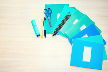 The different stationery on light background, flat lay with space for text. Back to school