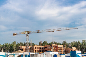 Formwork for monolithic construction of buildings. Monolithic construction technology. Construction of buildings using monolithic technology. Crane work at a construction site.