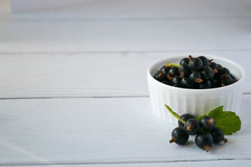 black currant berries in a white taredlock