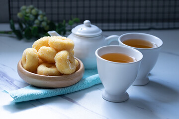 White ceramic tea set with donuts