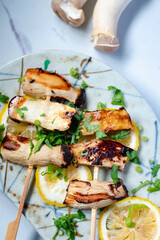 Pleurotus eryngii mushrooms grilled on skewers