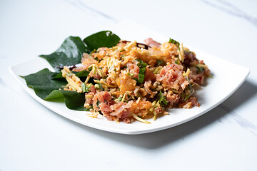 Spicy Salad of Curried Rice Croquettes Fermented Pork, Ginger and Peanuts.(Yam Naem Khao Thot)