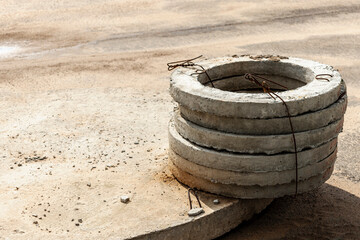 Installation of concrete sewer wells in the ground at the construction site. The use of reinforced...