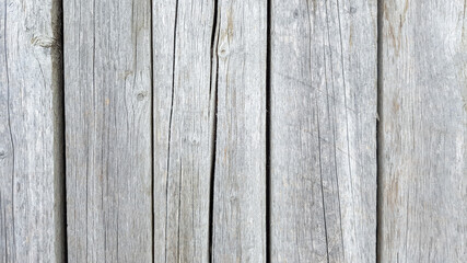 Naklejka premium Grunge plank wood texture background. Close up of gray wooden fence panels
