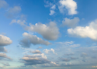 Obraz premium Looking up at the blue sky and white clouds background
