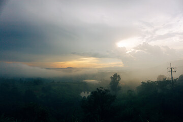 The view of the mountains after the rain with thick fog is beautiful at sunset.