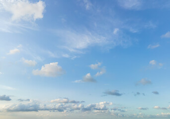 Looking up at the blue sky and white clouds background