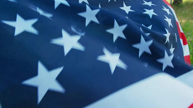 USA flag on the back of a child. 4 of Jule.