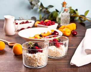 cottage cheese and yougurt with granola, berries and fruits apricot for healthy breakfast.