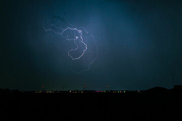 Freakishly shaped lightning bolt high in the sky
