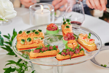 Assorted snacks on a festive New Year's table. Beautiful catering. High quality photo
