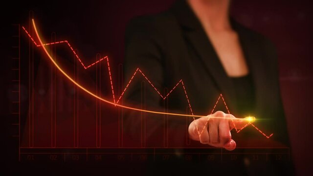 Female hand drawing a bright arrow showing decreasing earnings. Businesswoman drawing a descending financial chart. Touchscreen. Economic collapse, downward trend, business crash.