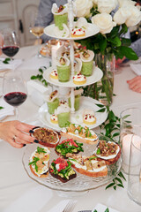 Assorted snacks on a festive New Year's table. Beautiful catering. High quality photo