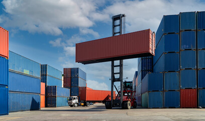 Engineers are overseeing the transportation of cargo with containers inside the warehouse....