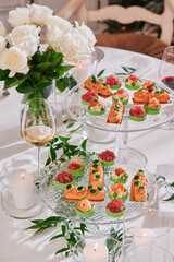 Assorted snacks on a festive New Year's table. Beautiful catering. High quality photo