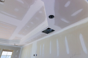 Finishing putty on drywall with a spatula wall