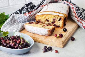 Jostaberry sponge cake on wooden board