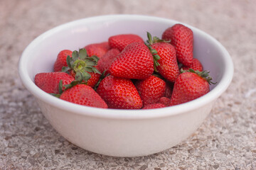 white bowl with fresh strawberries