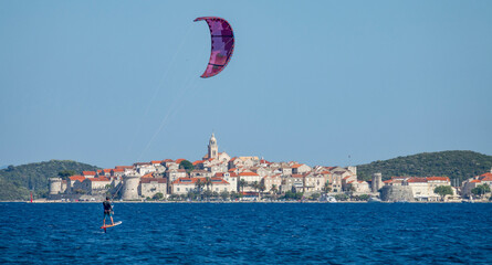 COPY SPACE: Fit man on active vacation in Croatia foilsurfs in the Adriatic sea.