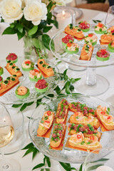 Assorted snacks on a festive New Year's table. Beautiful catering. High quality photo