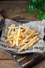 french fries on a wooden board