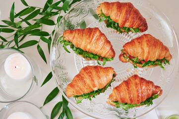 Mini croissants with filling on the festive table. Buffet, catering. High quality photo