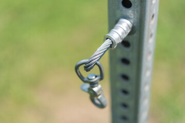 close up of a metal object (hook) fixed to a post