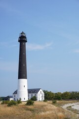 Fototapeta na wymiar Sorve lighthouse in Saaremaa islands, Estonia, vertical photo.