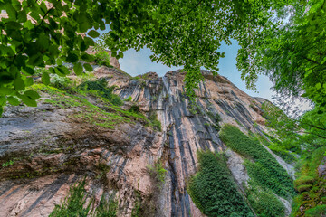 Bottom view of waterfall on huge wall