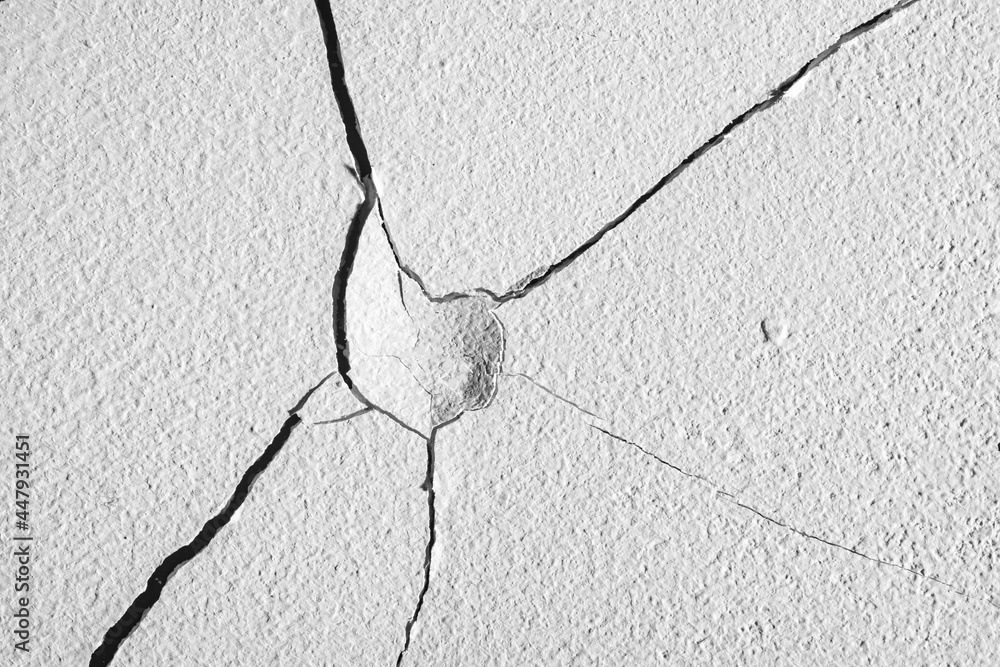 Wall mural cracks in the concrete wall.