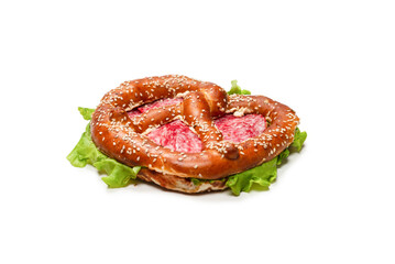 Pretzel with salami and lettuce isolated on a white background.
