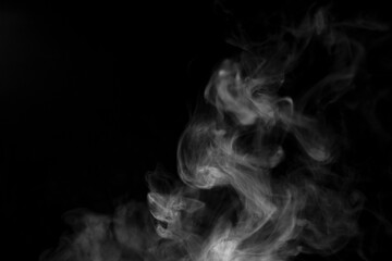 white smoke on black background for overlay effect. a realistic smoke effect for creating an...