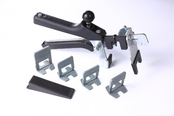 Tiler and tiler leveler kit with pliers, wedges and wedges