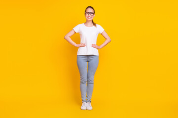 Fototapeta na wymiar Full body photo of young attractive woman happy positive smile confident hands on waist isolated over yellow color background
